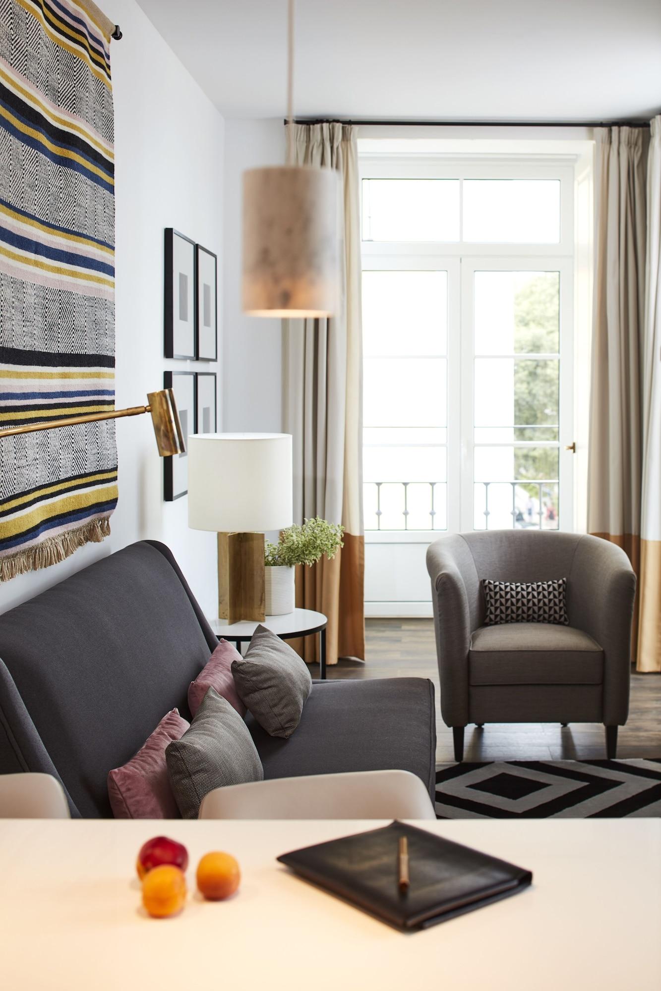 ליסבון The Lumiares Hotel & Spa - Small Luxury Hotels Of The World מראה חיצוני תמונה A living room with a sofa, armchair, and floor lamp